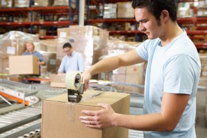 man with parcel and sellotape