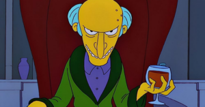 Mr Burns on a red chair